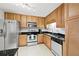 Modern kitchen with stainless steel appliances, wooden cabinets and granite countertops at 1468 Briarwood Ne Rd # 810, Brookhaven, GA 30319