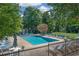 Inviting community pool with plenty of lounge seating and lush landscaping for relaxing summer days at 1468 Briarwood Ne Rd # 810, Brookhaven, GA 30319