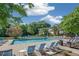 Beautiful community pool surrounded by lush landscaping, offering a resort-style living experience at 1468 Briarwood Ne Rd # 810, Brookhaven, GA 30319