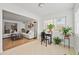Bright sunroom flowing into living room with large windows, tile floors, and plants at 1468 Briarwood Ne Rd # 810, Brookhaven, GA 30319