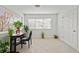 Bright sunroom with a work station, large windows, tile floors, and plants at 1468 Briarwood Ne Rd # 810, Brookhaven, GA 30319
