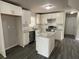 Updated kitchen featuring white cabinets, granite countertops, stainless steel appliances, and a central island at 3467 Valley Ridge Sw Ter, Atlanta, GA 30331