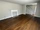 Bright living room with hardwood floors, a fireplace, and a staircase leading to the second floor at 3467 Valley Ridge Sw Ter, Atlanta, GA 30331