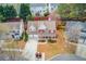Aerial view of a two-story house with a well-maintained yard and a two car garage at 3904 Tristan Way, Suwanee, GA 30024
