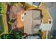 Aerial view of the home featuring a backyard, patio, well-manicured landscaping, and driveway at 3904 Tristan Way, Suwanee, GA 30024