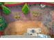 Aerial view of backyard featuring a patio, seating area, landscaped garden beds, and a privacy fence at 3904 Tristan Way, Suwanee, GA 30024