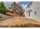 Spacious backyard with a patio area ideal for outdoor enjoyment and relaxation with a privacy fence at 3904 Tristan Way, Suwanee, GA 30024
