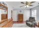 Bedroom featuring wood floors and an accent chair at 3904 Tristan Way, Suwanee, GA 30024