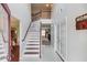 Bright foyer featuring high ceilings, staircase with wood railings, and tile flooring, offering a grand entrance at 3904 Tristan Way, Suwanee, GA 30024