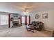 Cozy living room with stone fireplace, plush seating, and large windows for natural light at 3904 Tristan Way, Suwanee, GA 30024