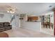 Spacious living room featuring a ceiling fan, open floor plan, and neutral carpet; ideal for Gathering gatherings at 3904 Tristan Way, Suwanee, GA 30024