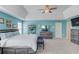 Tranquil main bedroom with a tray ceiling, carpet, and light teal walls at 3904 Tristan Way, Suwanee, GA 30024