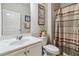 Clean bathroom with a single sink vanity, decorative shower curtain, and modern fixtures at 558 Carleton Pl, Locust Grove, GA 30248