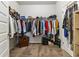 Full walk-in closet with shelving and clothing racks filled with organized garments and accessories at 558 Carleton Pl, Locust Grove, GA 30248
