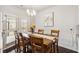 Cozy dining room featuring a wooden table, six chairs, and a chandelier at 558 Carleton Pl, Locust Grove, GA 30248
