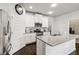 Well-lit kitchen with stainless steel appliances, granite countertops, and ample cabinet space at 558 Carleton Pl, Locust Grove, GA 30248