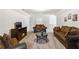 Cozy media room featuring comfortable seating, a fireplace and a TV at 558 Carleton Pl, Locust Grove, GA 30248