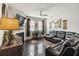 Cozy living room with a fireplace, hardwood floors, and stylish furnishings at 558 Carleton Pl, Locust Grove, GA 30248
