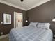 Comfortable bedroom showcasing neutral walls and carpet with a view to the ensuite bath at 62 Emerson Hill Sq, Marietta, GA 30060