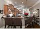 Kitchen features granite counters, breakfast bar, pendant lighting, and stainless appliances at 62 Emerson Hill Sq, Marietta, GA 30060