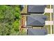 An aerial perspective highlighting backyards of homes with manicured landscaping and privacy at 163 Neese Farm Dr, Woodstock, GA 30188