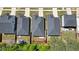 Aerial view of the rooftops and yards of several homes; landscaping in the backyards is well maintained at 163 Neese Farm Dr, Woodstock, GA 30188