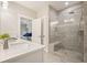 Bathroom featuring a quartz countertop vanity and luxurious glass enclosed shower with bench at 163 Neese Farm Dr, Woodstock, GA 30188