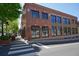 Street view of a well-maintained commercial building with ample windows and pedestrian-friendly access at 163 Neese Farm Dr, Woodstock, GA 30188