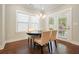 Cozy dining area with hardwood floors, modern light fixture, and French doors to the outside at 163 Neese Farm Dr, Woodstock, GA 30188