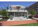 Modern restaurant exterior with an open-air rooftop patio, complemented by sleek design and surrounding greenery at 163 Neese Farm Dr, Woodstock, GA 30188