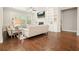 Bright living room features hardwood floors, fireplace, built-in shelves, and neutral furniture at 163 Neese Farm Dr, Woodstock, GA 30188