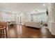 Spacious living area with hardwood floors, abundant natural light, and a dining space with modern light fixture at 163 Neese Farm Dr, Woodstock, GA 30188