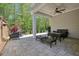 This open-air patio features a ceiling fan and plenty of room to relax at 163 Neese Farm Dr, Woodstock, GA 30188