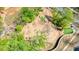 An aerial shot showcases a well-maintained playground with modern equipment nestled among lush trees at 163 Neese Farm Dr, Woodstock, GA 30188