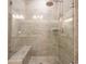 Tiled shower with glass door and rain shower head, bench, and built in shelf at 163 Neese Farm Dr, Woodstock, GA 30188