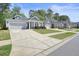 A row of attractive single-Gathering homes with well-kept lawns and driveways on a quiet, tree-lined street at 163 Neese Farm Dr, Woodstock, GA 30188