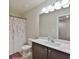 Well-lit bathroom featuring a vanity with storage and a shower-tub combination at 5522 Donerail St, Lithonia, GA 30058