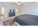 Spacious bedroom featuring a tray ceiling, ceiling fan and plush carpeting at 5522 Donerail St, Lithonia, GA 30058
