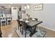 Formal dining room features a modern chandelier, place settings, and elegant decor at 5522 Donerail St, Lithonia, GA 30058