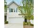 Lovely townhome with a two-car garage and charming curb appeal, a perfect place to call home at 5522 Donerail St, Lithonia, GA 30058