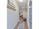 Inviting hallway with hardwood floors and neutral paint, offering a warm and welcoming entrance at 5522 Donerail St, Lithonia, GA 30058