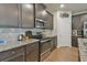 Well-equipped kitchen with granite countertops and stainless steel appliances for culinary enthusiasts at 5522 Donerail St, Lithonia, GA 30058