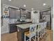 Bright kitchen boasts a center island with bar seating and granite countertops at 5522 Donerail St, Lithonia, GA 30058