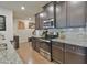 Modern kitchen featuring granite countertops, stainless steel appliances, and ample storage for convenience at 5522 Donerail St, Lithonia, GA 30058