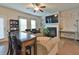Spacious living room features a fireplace, modern furniture, and great natural light at 5522 Donerail St, Lithonia, GA 30058