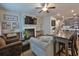 This comfortable living room features a fireplace, artwork, and a dining table set at 5522 Donerail St, Lithonia, GA 30058