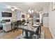 Open concept living and dining space with hardwood floors and modern finishes at 5522 Donerail St, Lithonia, GA 30058