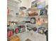 Walk-in pantry features ample shelving for food storage at 5522 Donerail St, Lithonia, GA 30058
