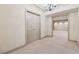 Spacious carpeted basement with double closet doors and decorative trim in neutral color palette at 6840 N Creekside Pt, Cumming, GA 30041