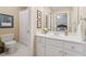 Bathroom featuring white vanity, framed art, and toilet at 6840 N Creekside Pt, Cumming, GA 30041